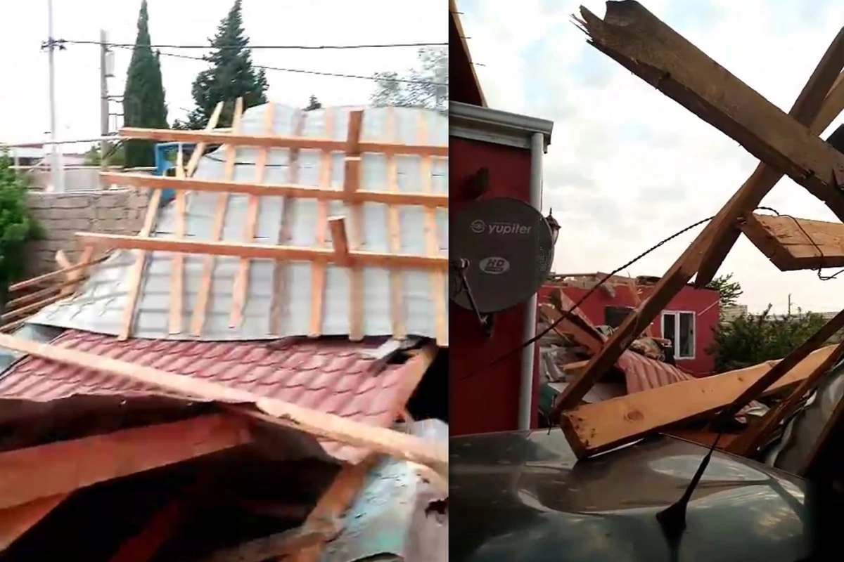 Bakıda güclü külək dam örtüyünü uçurtdu - Evlərə və maşınlara ziyan dəydi